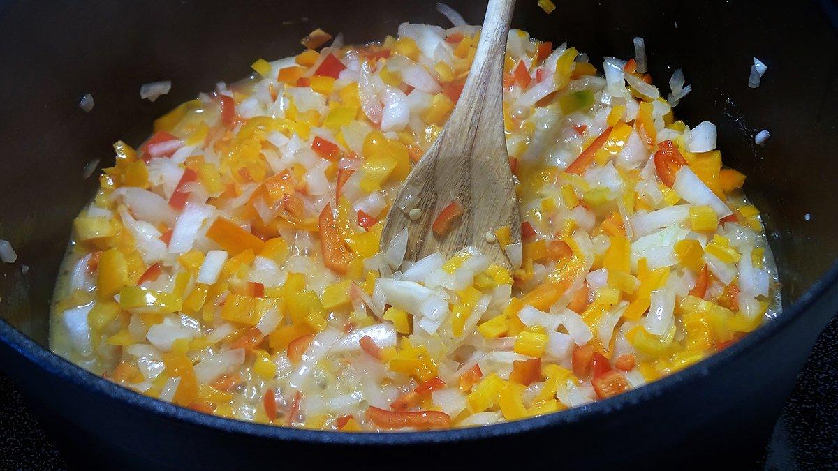 Saute the onions and peppers in a bit of butter to start the chowder.