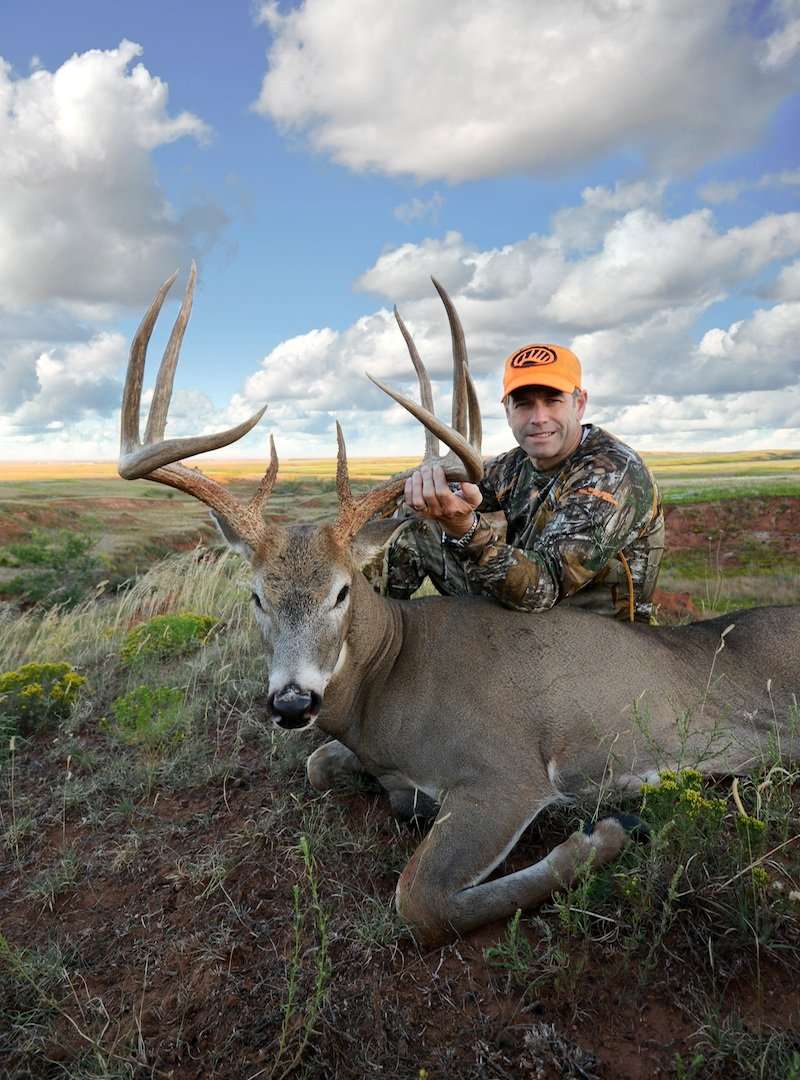 Bigbee with his kill from 2013 - a monster Kansas 9-pointer.