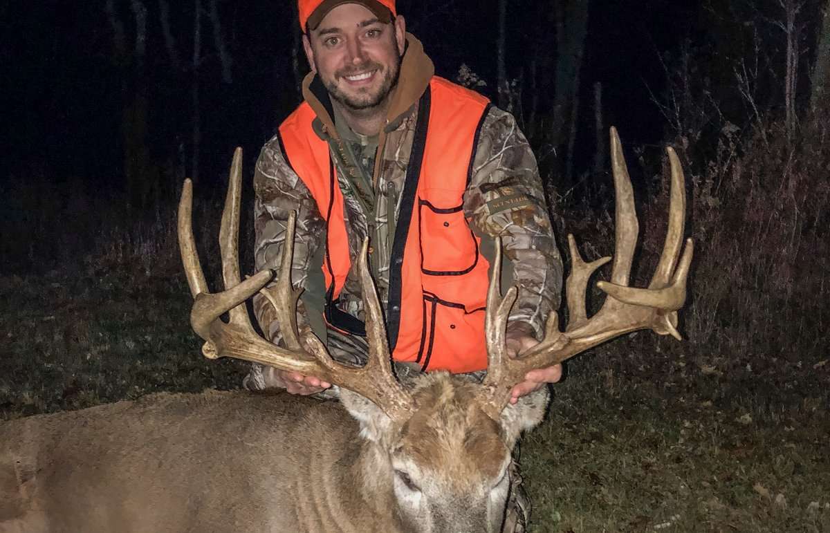 Travis Mlodik happily shows off his huge Wisconsin rifle buck. (Travis Mlodik photo) Travis Mlodik happily shows off his huge Wisconsin rifle buck. (Travis Mlodik photo)
