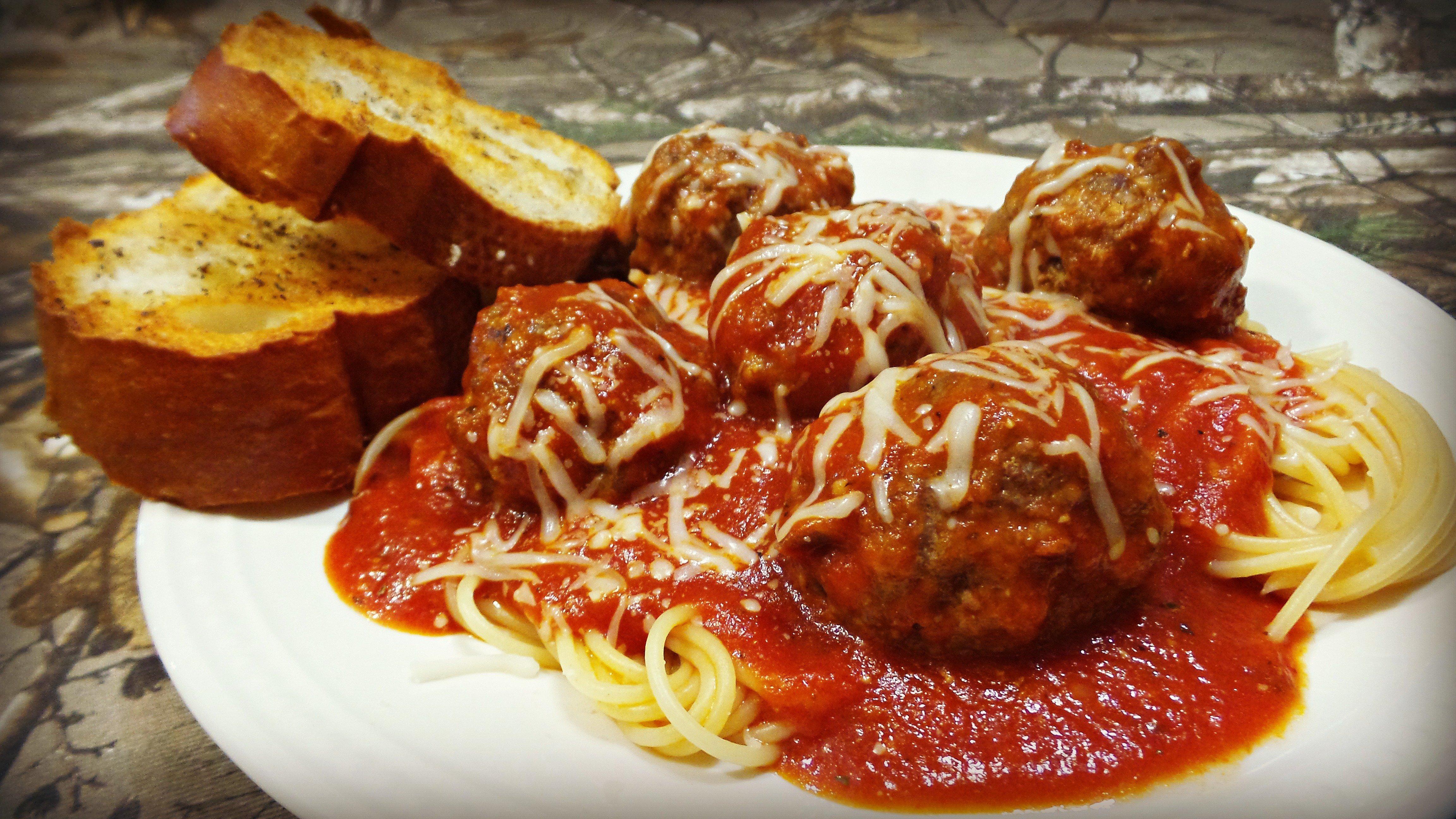 Venison meatballs simmered in marinara sauce over spaghetti.   