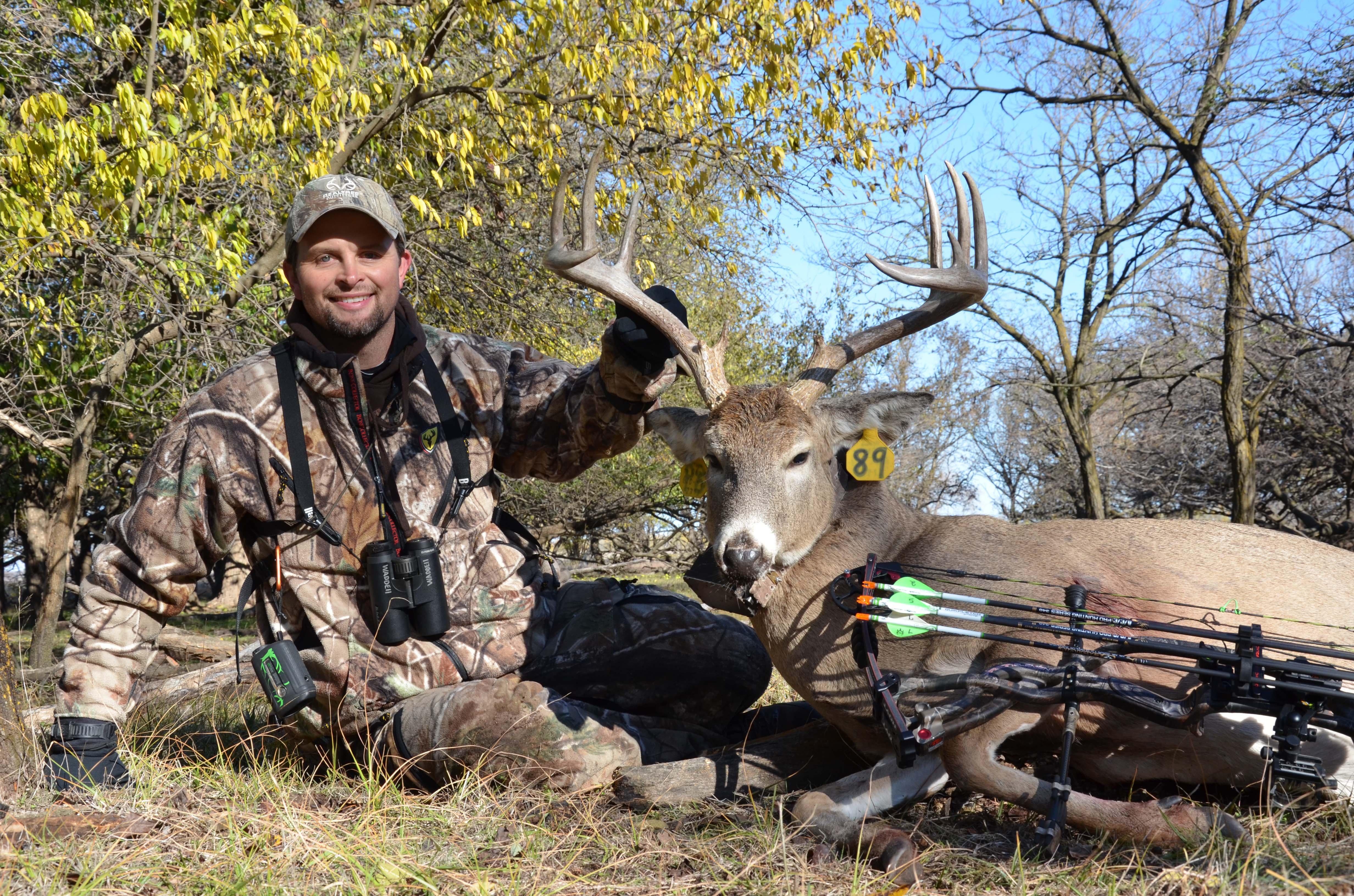 Michael Waddell with the radio collared buck. 