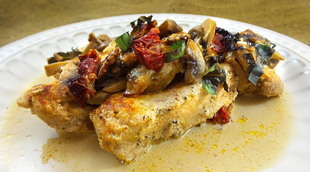 Make sure to spoon plenty of the cream sauce over the turkey, tomatoes and mushrooms.