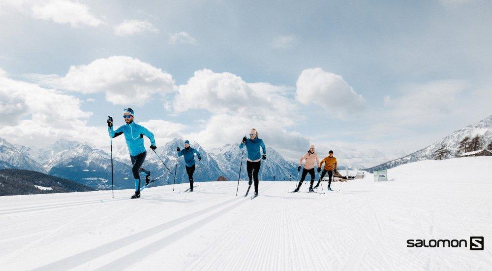 a group of people cross country skiing 