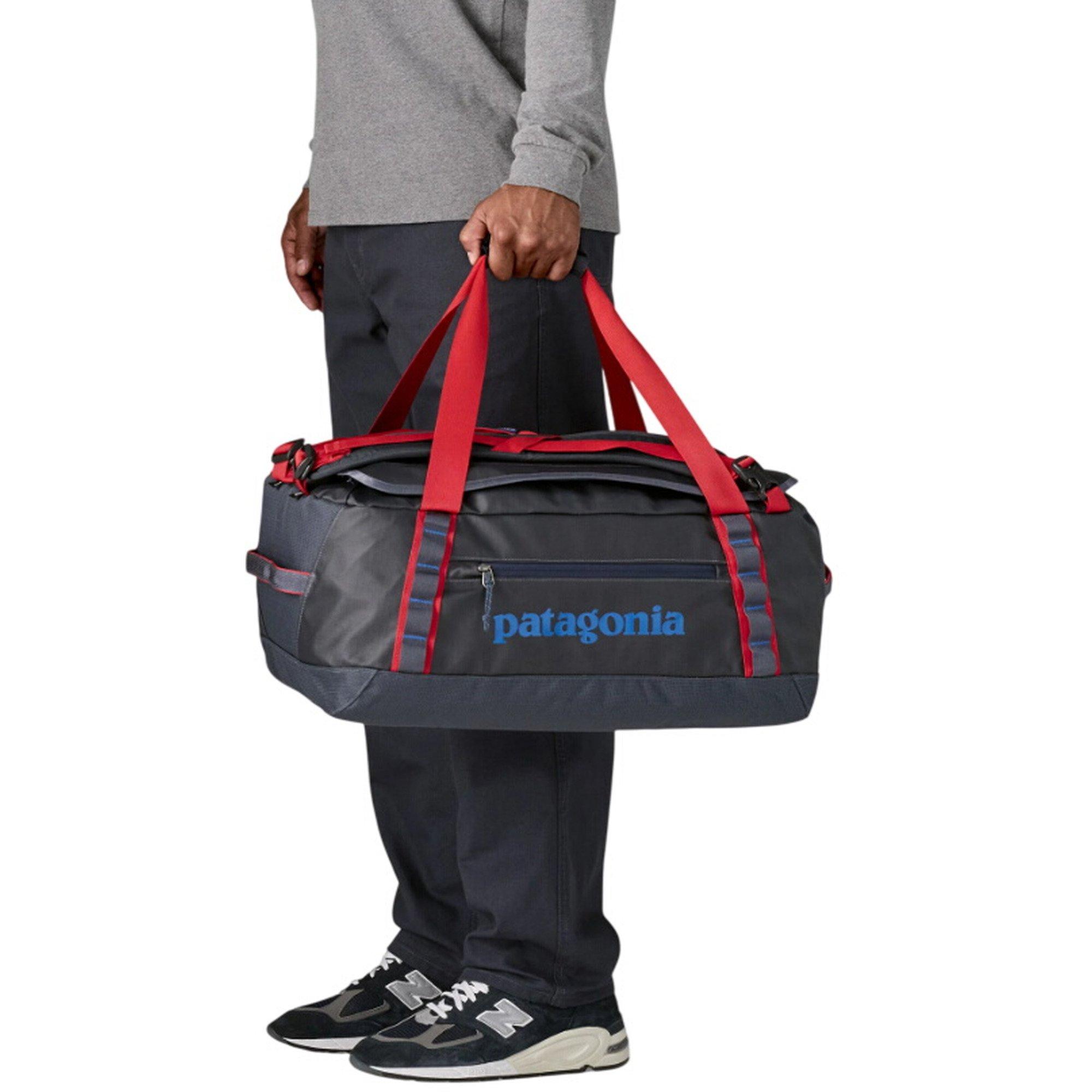 scheels patagonia bag Patagonia 40L Black Hole Duffel Smolder Blue/Amanita Red