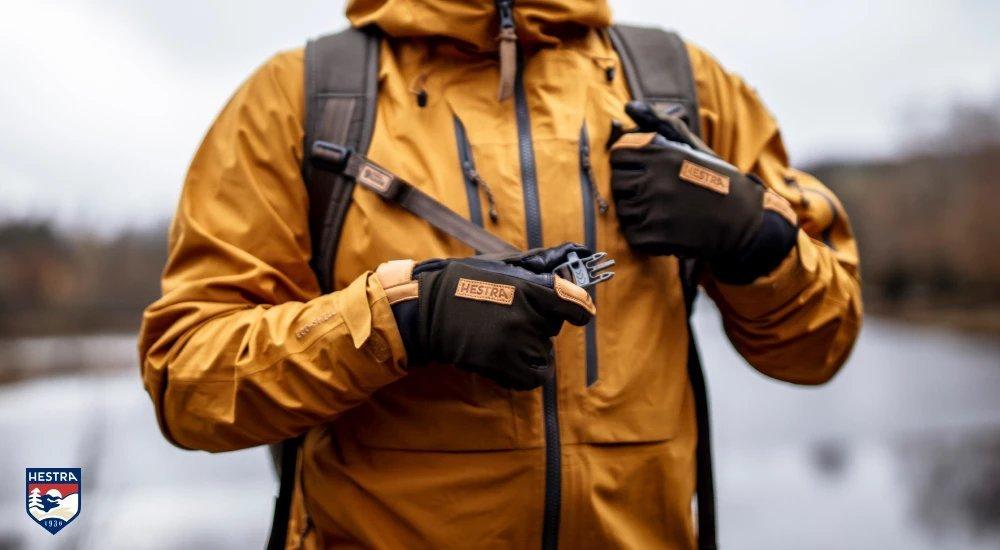 a man wearing Hestra gloves in winter