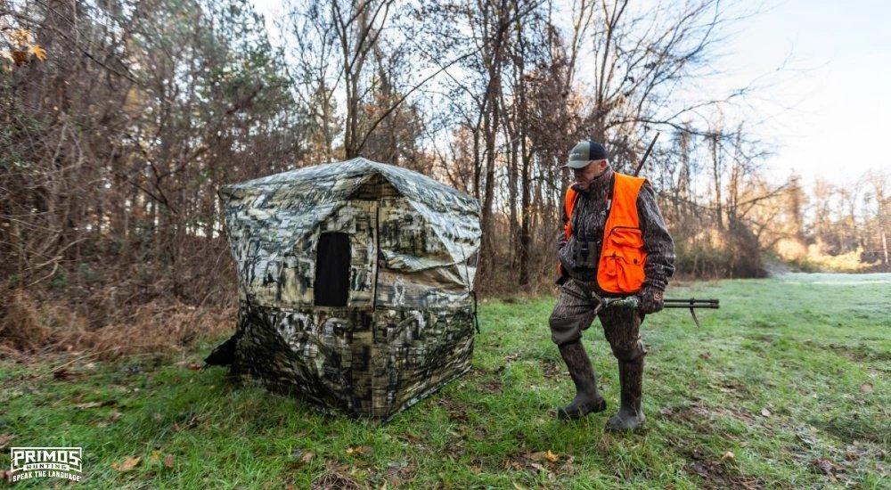 a hunter setting up a ground blind