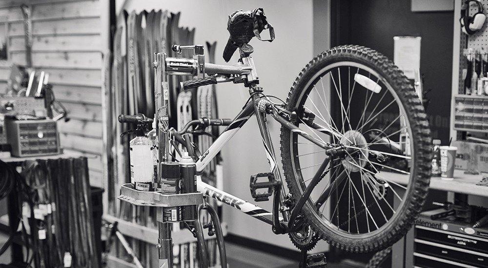 a bike at a SCHEELS service shop getting tuned up