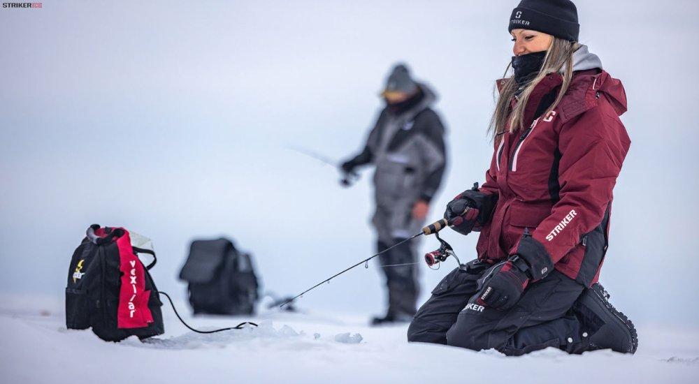 an ice angler using a Vexilar to find fish