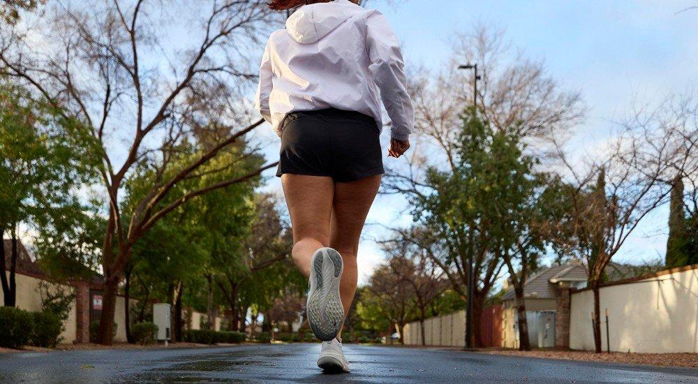 a girl running down the street