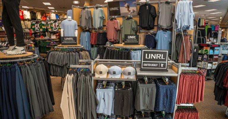 a selection of men's clothing on display at st cloud scheels