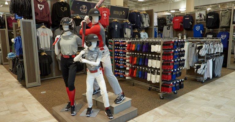 baseball and softball clothing display at a SCHEELS store location
