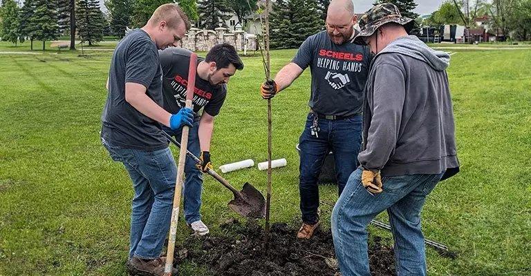 a group of people volunteering with SCHEELS