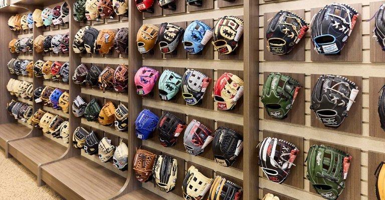 baseball and softball glove display at a SCHEELS store location