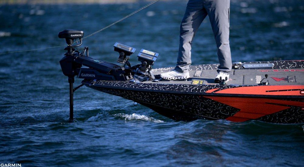an angler fishing from a boat using a live sonar unit