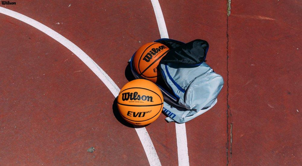 two basketball and a bag on the basketball court