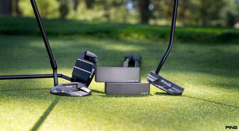 a variety of ping putters on the green