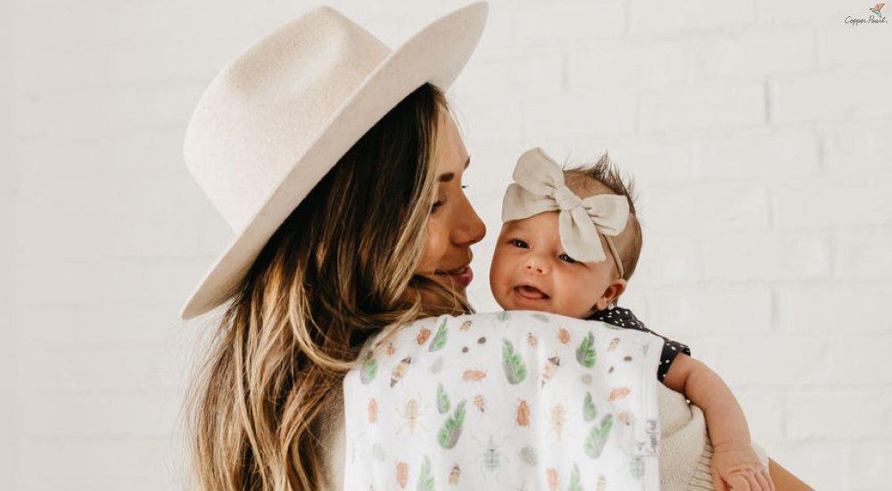 a mom holding a brand new babay