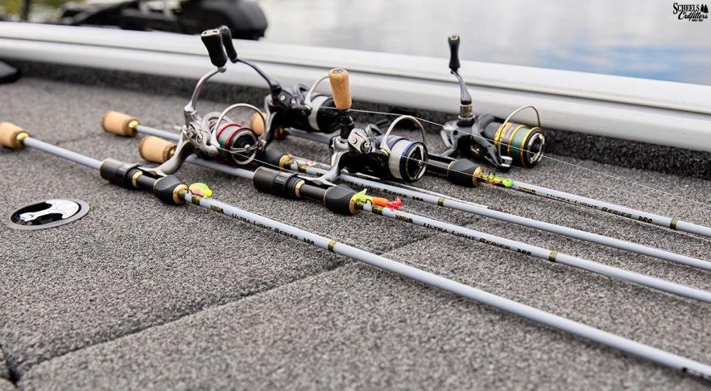 a variety of spinning rods laying on the boat