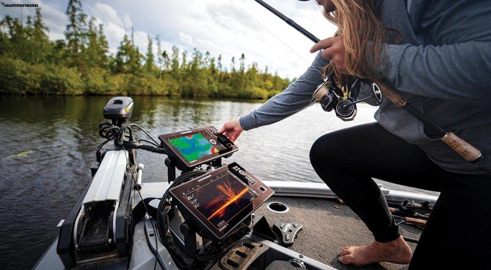a lady on the water with a fish finder
