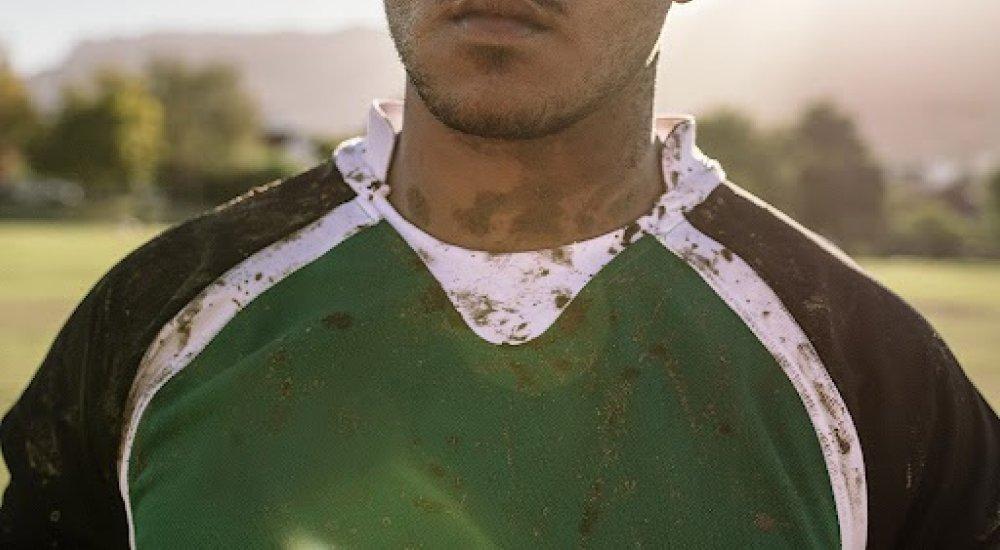 an athlete wearing a dirty sports jersey at practice