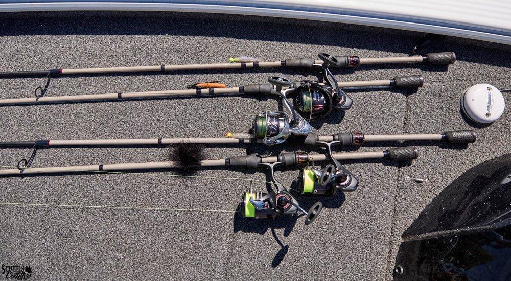 a selection of fishing rods laying in a boat