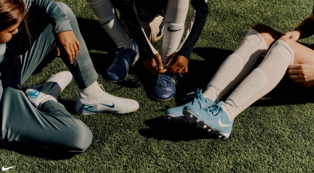 a group of players wearing Nike soccer cleats