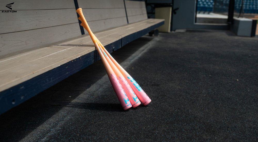a selection of Easton baseball bats in the dugout
