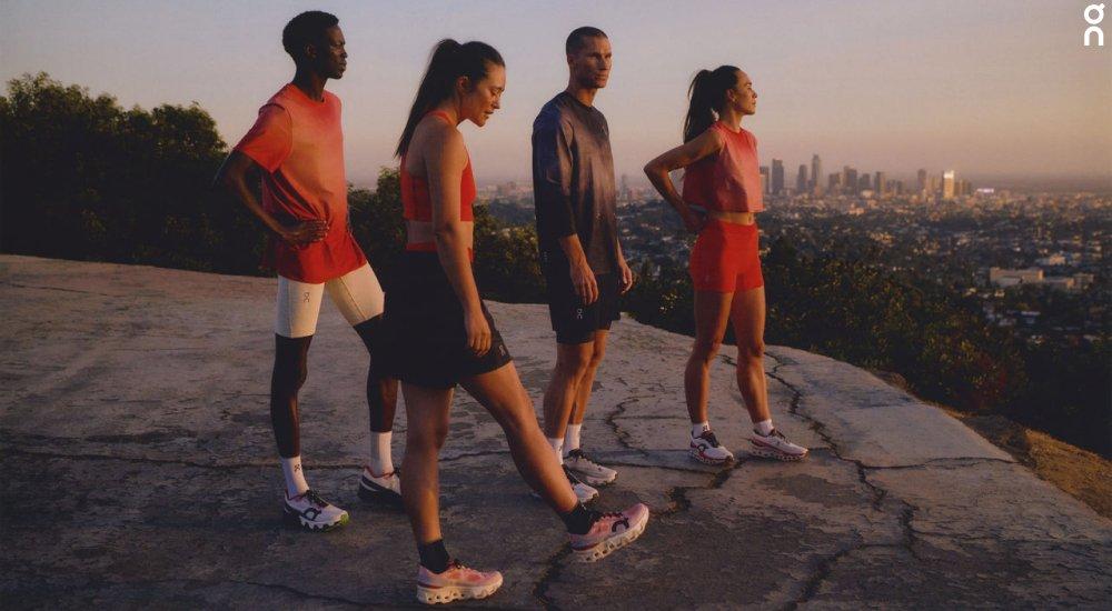 a group of runners wearing on running shoes
