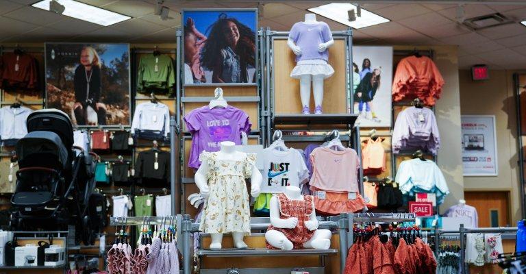 a selection of clothing for baby and kids