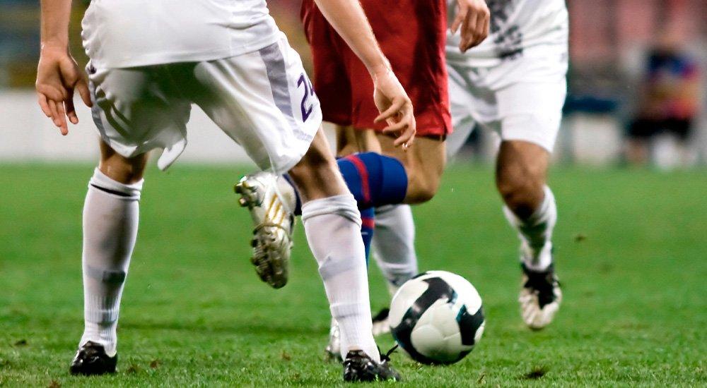 soccer players with a soccer ball