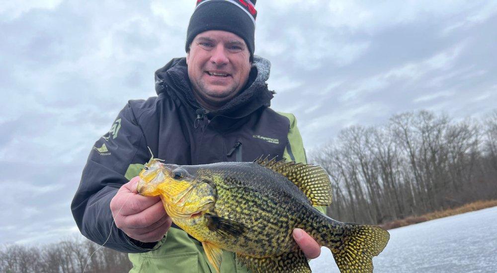 pro-staff Jason Mitchell holding a crappie