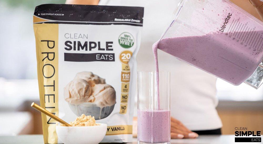 person pouring a smoothie with protein powder in the back