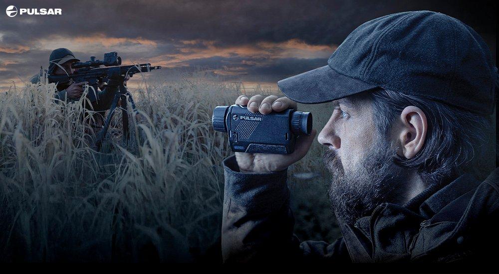 hunter looking through a rangefinder