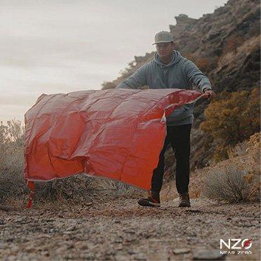 Coleman lifestyle of campers setting up tent fly