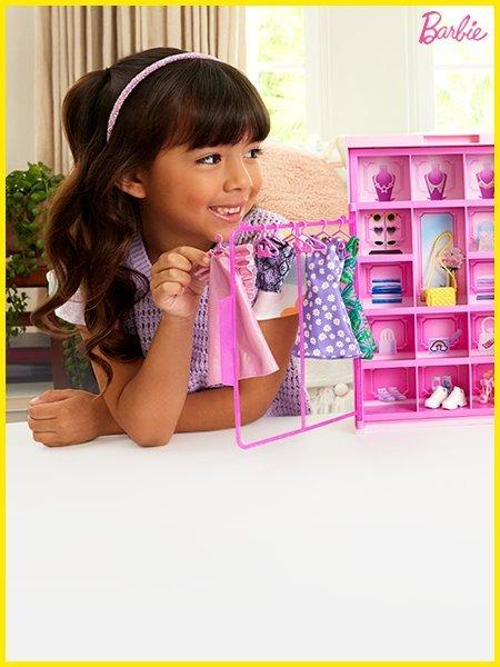 Little girl playing with barbies and shop all gifts for girls