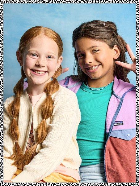 2 girls smiling for a photo