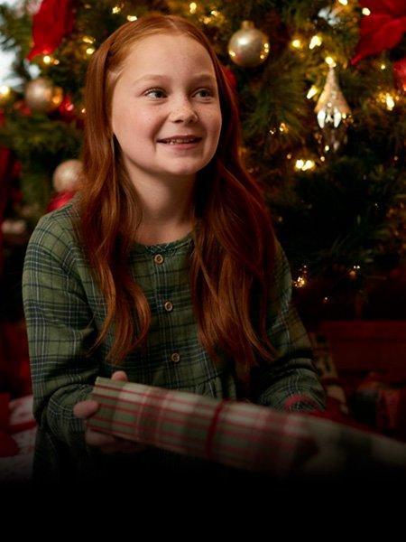 Girl holding Christmas gift
