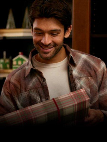 Man holding Christmas present