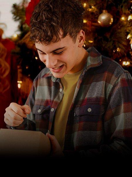 Teen opening Christmas gift