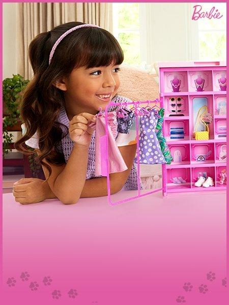 Little girl playing with barbies and shop all gifts for girls