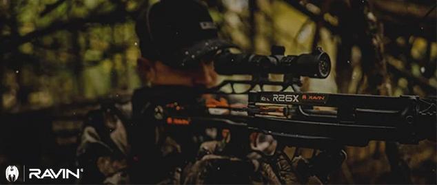 Hunter taking aim with Ravin crossbow