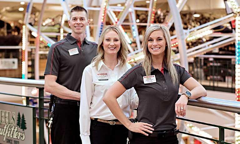 employees standing in front of the ferris wheel