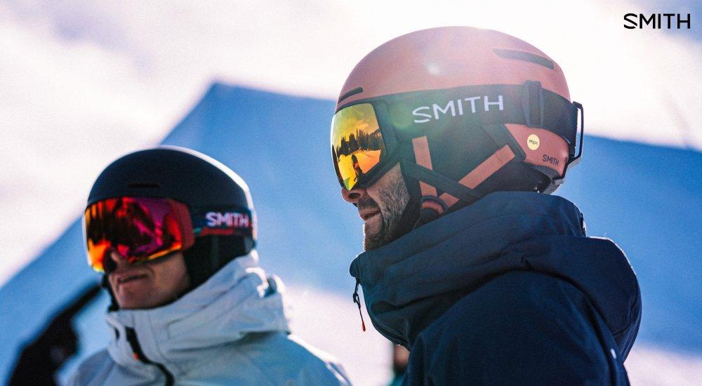 two guys wearing snow helmets and ski goggles from smith