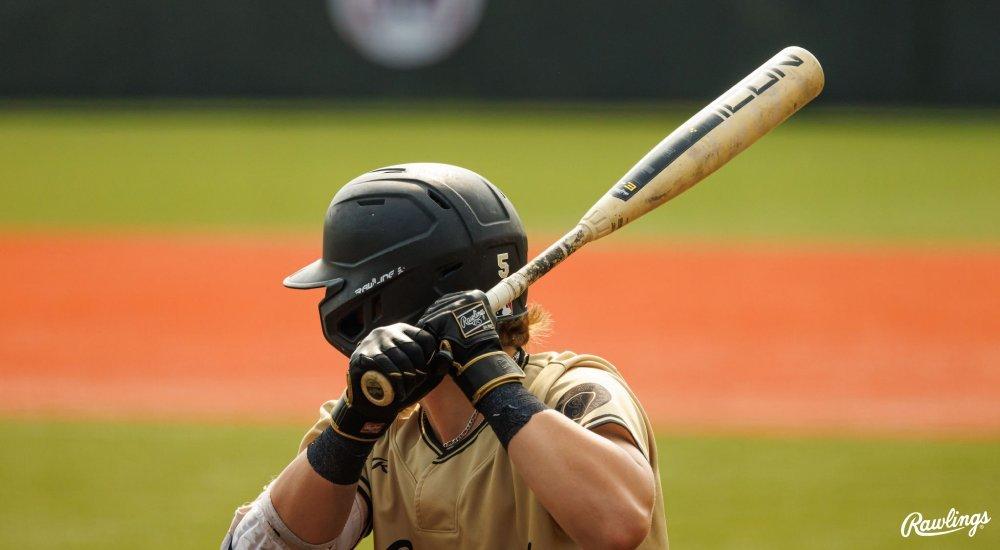 baseball player preparing to swing bat