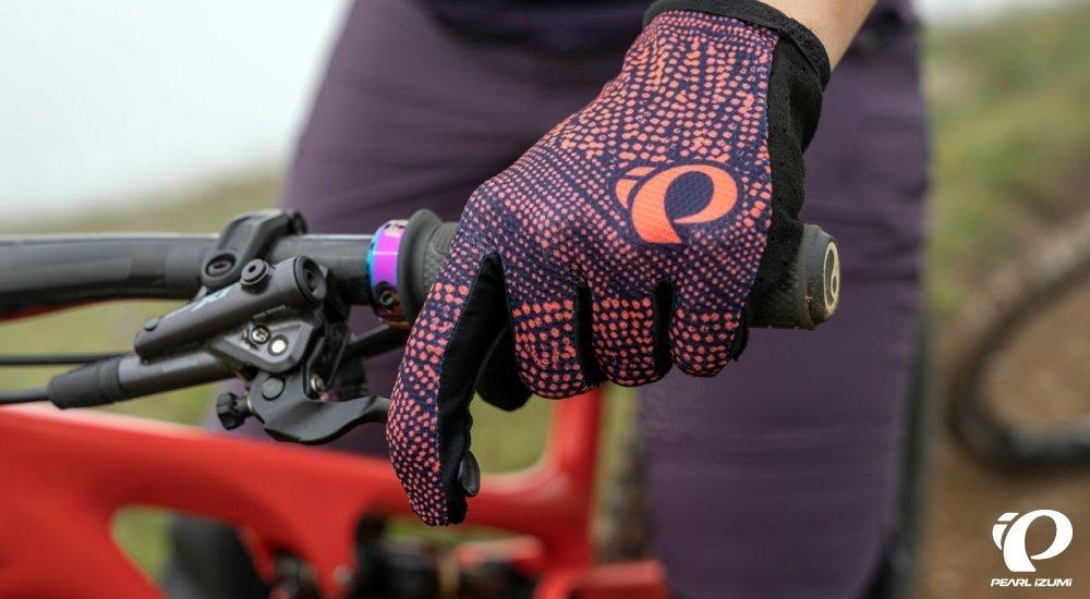 cyclist with gloves holding onto bike handle