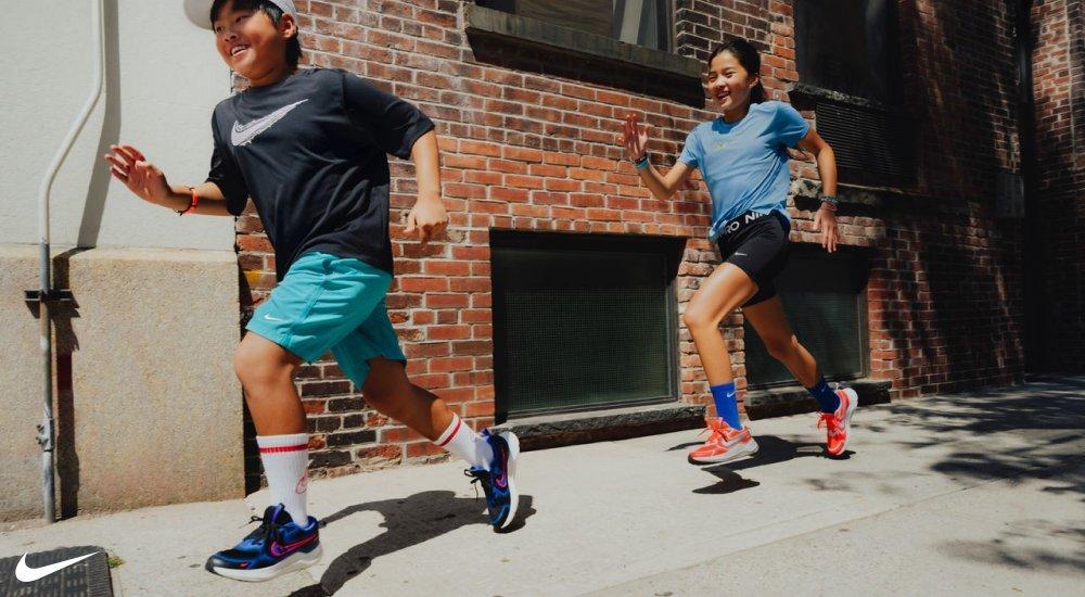 two kids running in nike apparel