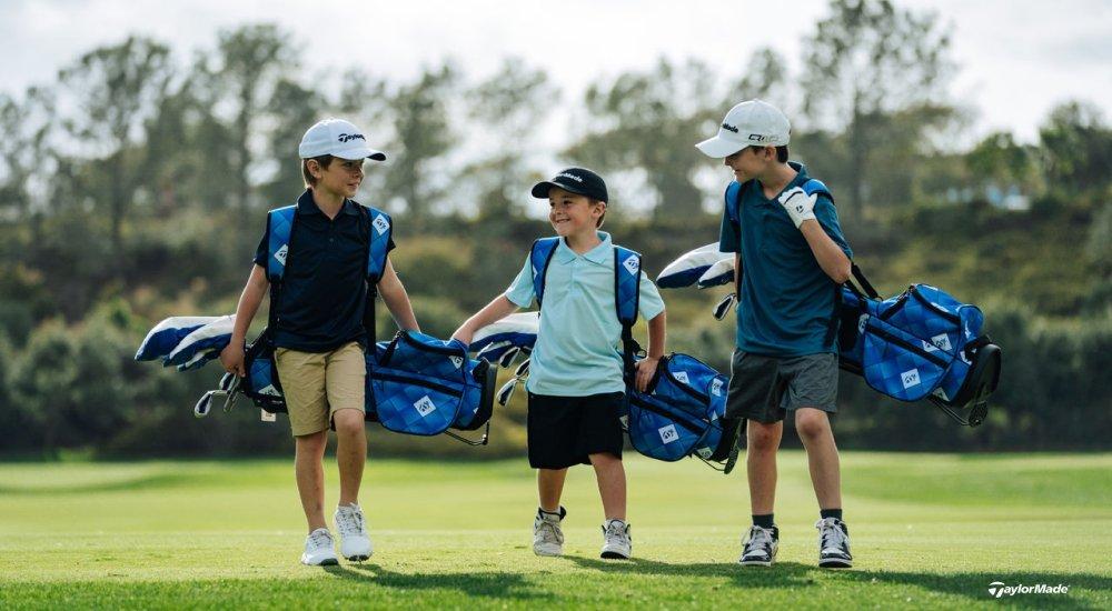 Three boys with TaylorMade golf sets