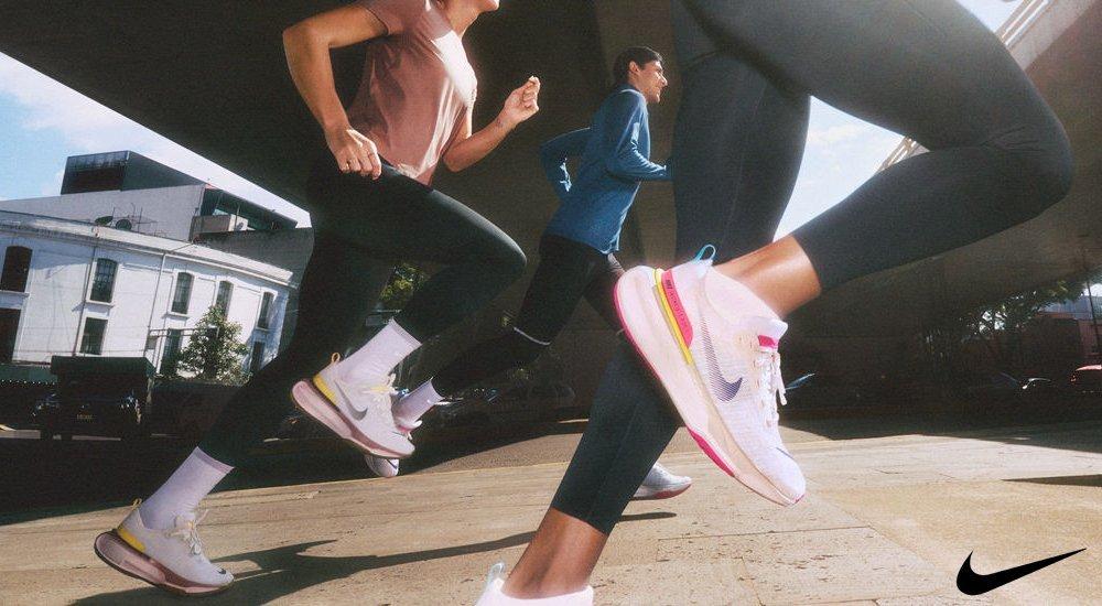 three people running in their nike shoes