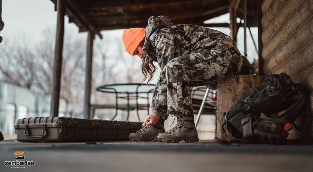 woman tying her hunting boots