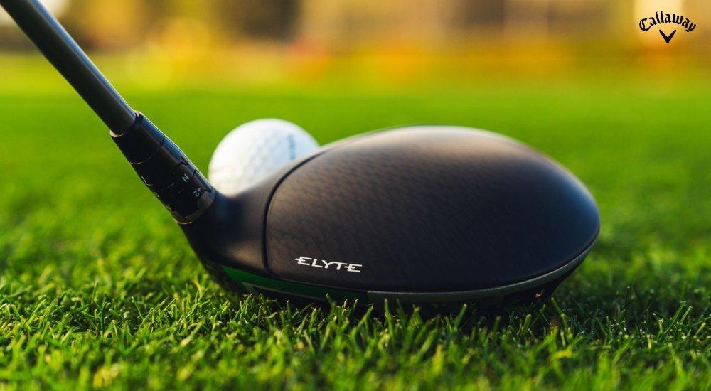 A Callaway Elyte driver next to a golf ball in the grass